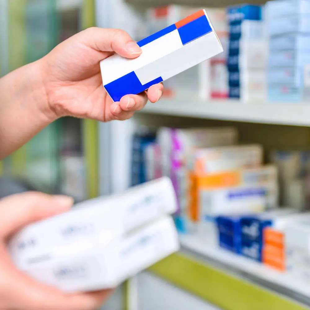 consumer holding a medicine box