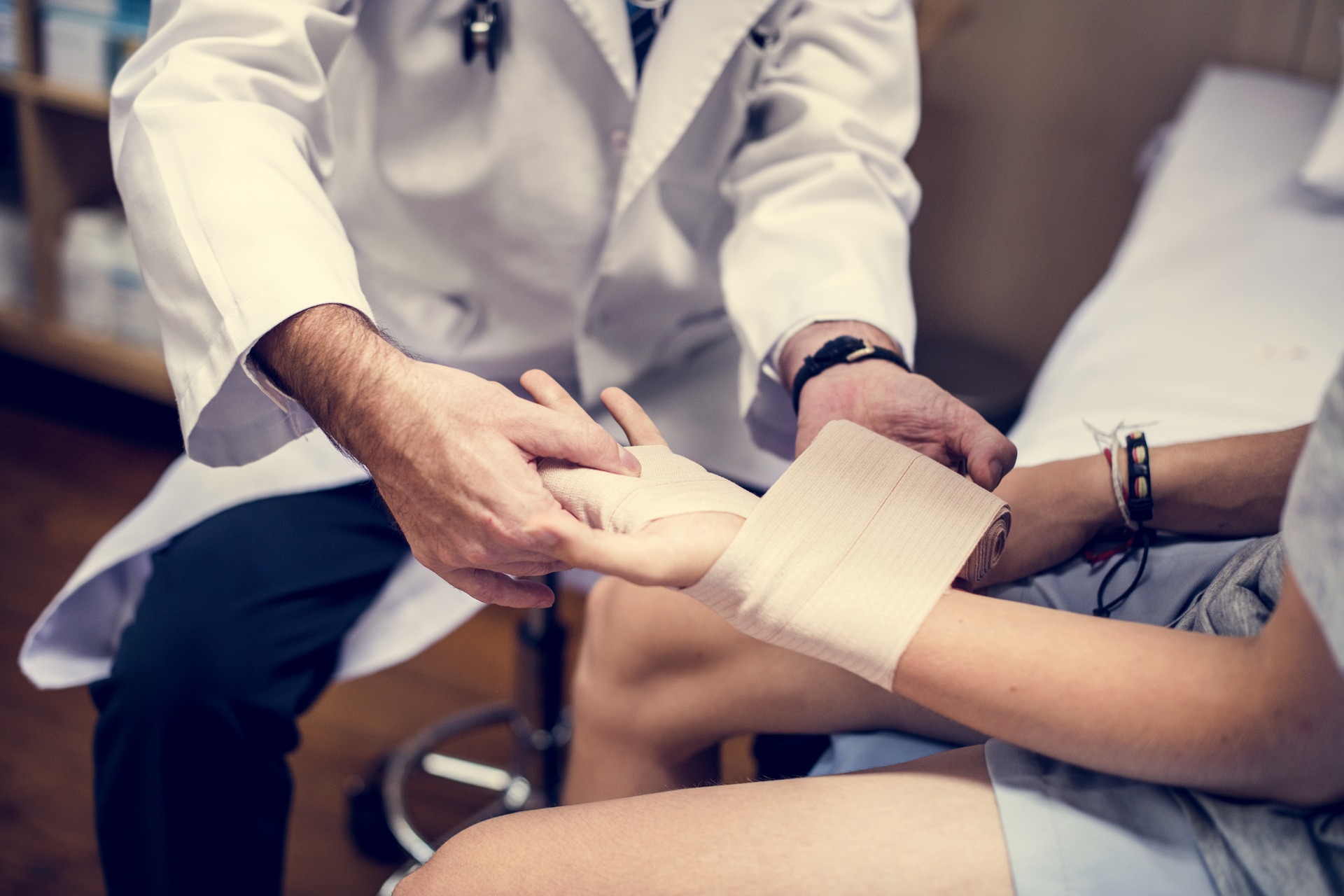 doctor assisting a patient