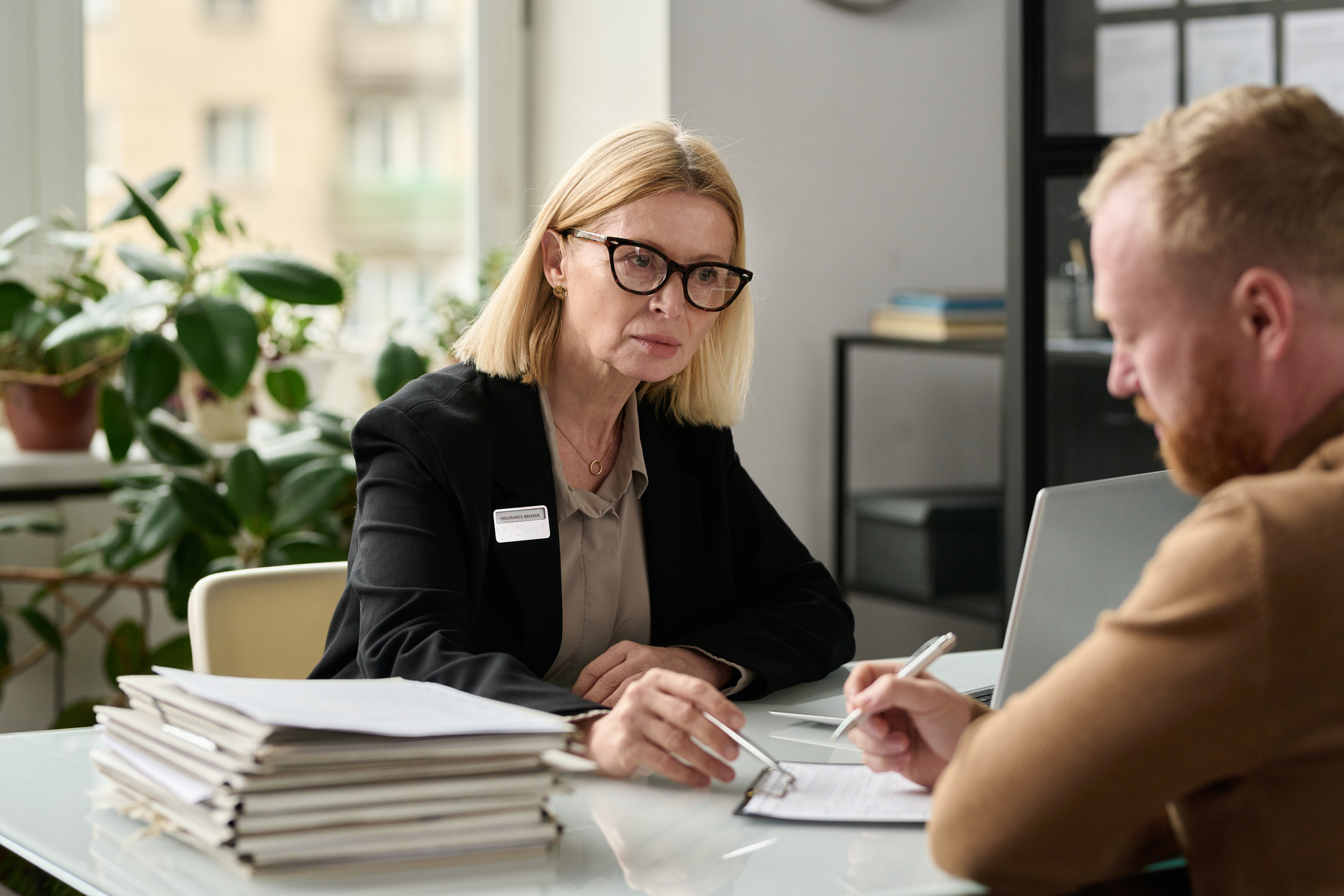 Consultant reviews documents with a client