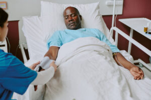 Assisting Elderly Patient During Medical Examination