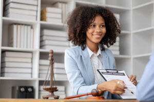female lawyer showing contract to client