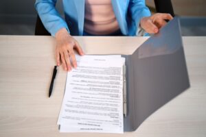 female lawyer sitting at her desk and reading
