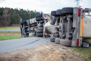 Overturned commercial truck blocking a roadway after a serious crash, illustrating cases handled by a Columbia truck accident lawyer.